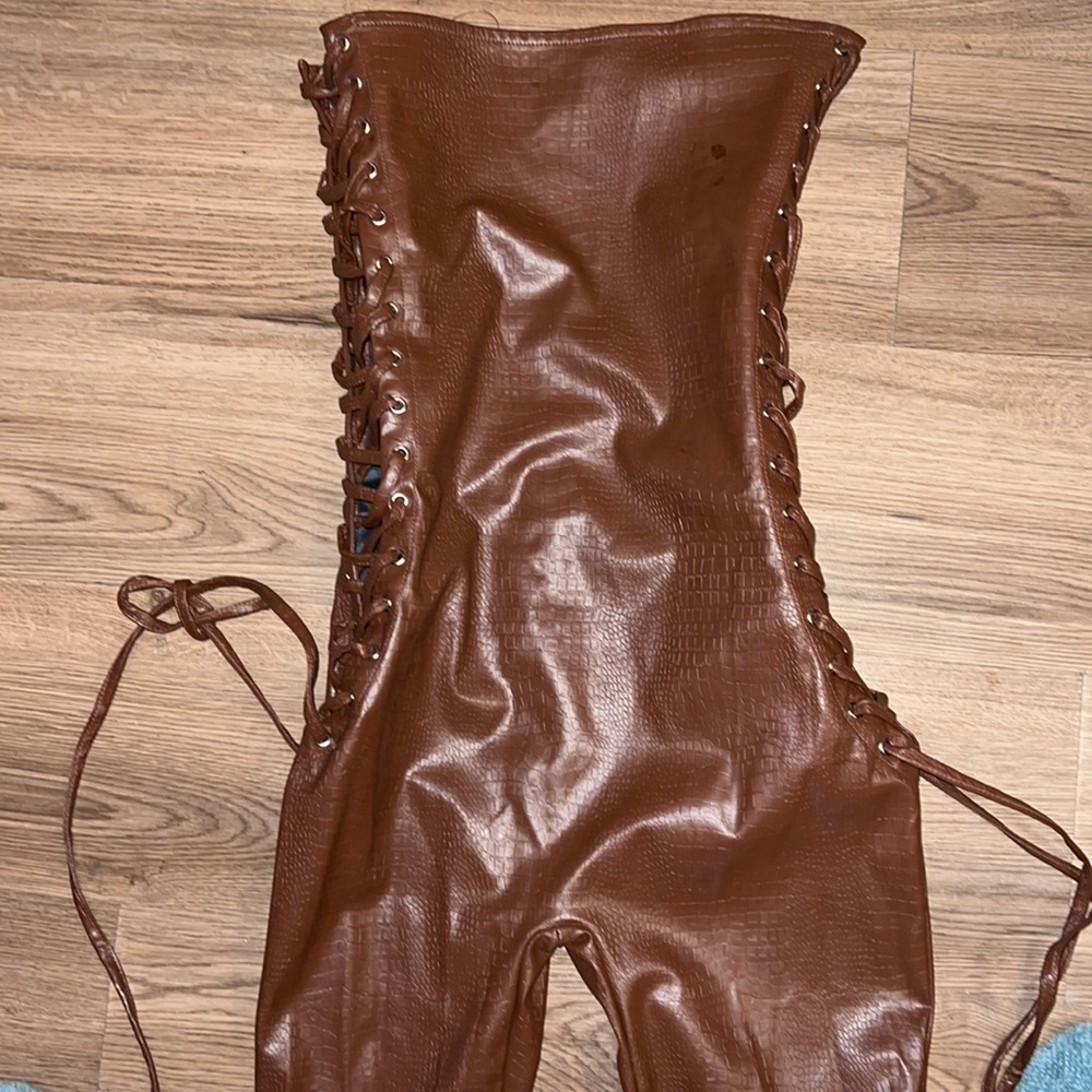 Brown, snake skin latex strapless catsuit